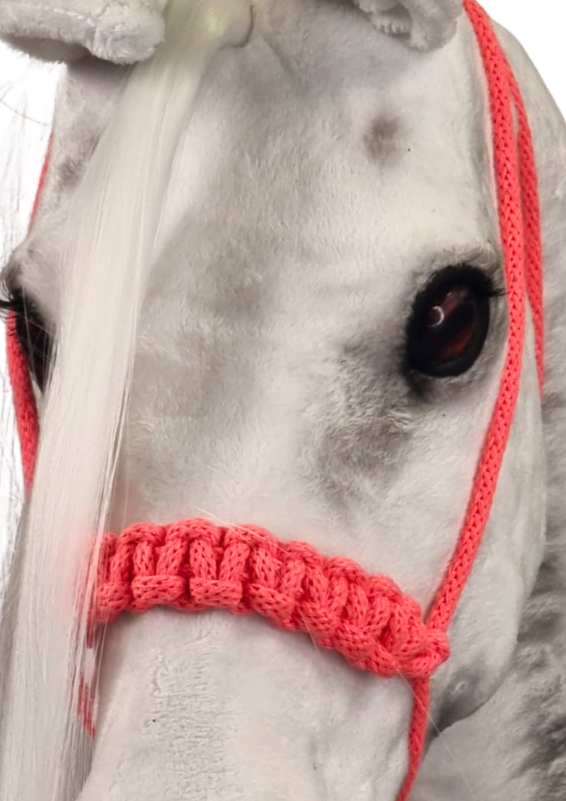 A halter with reins for realistic hobby horses.